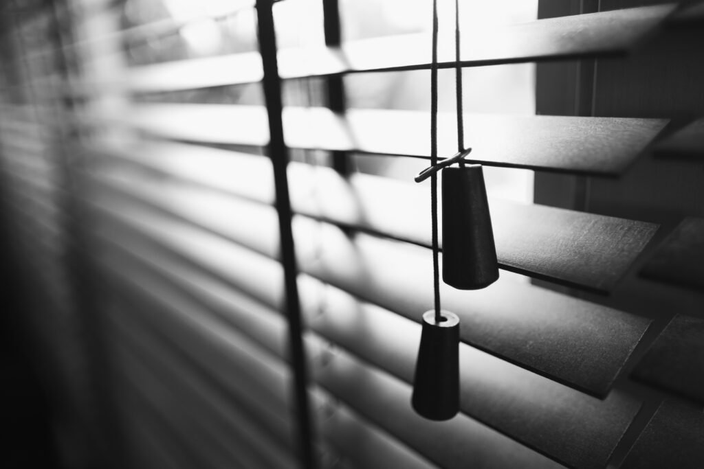 Wooden blinds with sun light