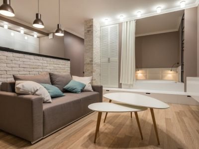 Living room with hardwood floors and light fixtures